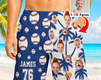 May include: Customized swim trunks featuring a split design with a dark blue side displaying white baseballs and the text JAMES 76, and a white side with blue palm trees, human faces, and animal faces. Includes a small inset showing a baby.