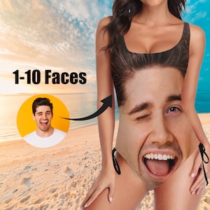 May include: A one-piece swimsuit with a large, smiling face printed on the front. The swimsuit has black straps and ties. The text "1-10 Faces" is displayed in the upper left corner, with an image of a man winking.