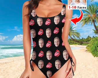 May include: A black one-piece swimsuit featuring a repeating pattern of a person's face and red lips with a tongue sticking out. The swimsuit has a scoop neckline and adjustable side ties. An inset shows a person with the text 1-10 Faces.
