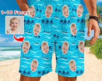 May include: Blue swim trunks with a repeating pattern of baby faces, palm trees, and ocean waves. The text "1-10 Faces" is in the upper left corner. The trunks have a drawstring waist and pockets.
