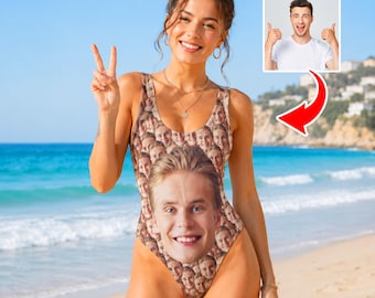 May include: A one-piece swimsuit featuring a repeating pattern of a person's face printed across the fabric. The design includes a larger, prominent face centered on the torso, with smaller versions of the same face covering the rest of the garment. The text 1-10 Faces is visible in the upper right corner, along with an inset image of a person giving a thumbs up.