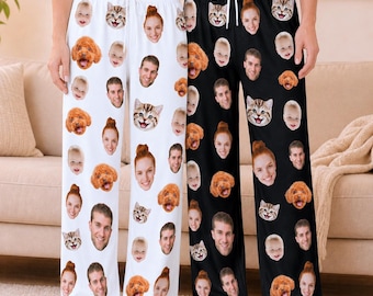 May include: Two pairs of lounge pants, one white and one black, featuring an all-over print of repeating faces of people, a cat, and a dog. Both pairs have an elastic waistband with a white drawstring and a loose, straight-leg fit.