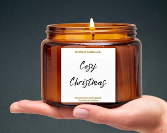 May include: A brown glass jar candle with a white label that reads "Monlix Candles Cosy Christmas Scented Soy Wax Candle Poured in London".