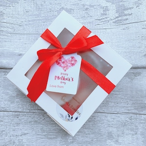 May include: White gift box with a red ribbon and a tag that says "Happy Mother's Day Love from" and a sticker that says "Handmade Monlix Candles".