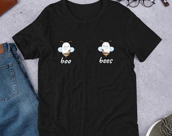 May include: Black t-shirt with a white ghost and bee graphic. The ghost says "boo" and the bee says "bees".