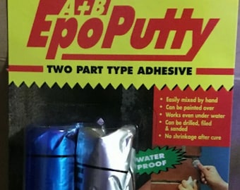 May include: A package of Alteco Epo Putty, a two-part adhesive. The package features two tubes, one blue and one silver, with the product name in red. The packaging highlights features like being waterproof and suitable for various materials.