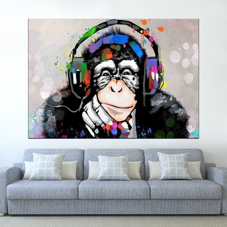 Cool boy with headphones listening music, colorful paints smudges