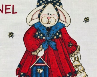 May include: A white bunny wearing a red dress with a blue scarf and a checkered bow. The bunny is holding a blue birdhouse and a yellow bag with bees. The background is white with the word "NEL" in red.