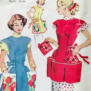 May include: A vintage sewing pattern for two different styles of aprons. The first apron is blue with red tulips and the second is red with white polka dots. Both aprons have large pockets and are tied at the waist. The pattern is titled "Easily Made".