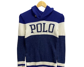 May include: A blue and white striped sweater with a hood and a large "POLO" logo on the front.