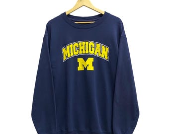 ヴィンテージ ミシガン・ウルヴァリンズ スウェットシャツ XLサイズ NCAA カレッジフットボール クルーネック プリントロゴ入りジャンパー サイズXL