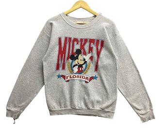 Sudadera gris vintage de Mickey Florida de los años 90 para mujer, talla grande, de Walt Disney Company, con cuello redondo, estampado de dibujos animados de Mickey, Goofy y el Pato Donald, con el logotipo.