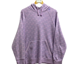 Sudadera con capucha Champion Vintage con estampado completo, talla 2XL, logo estampado por toda la prenda.