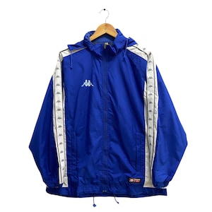 May include: A blue hooded jacket with white side panels and white Kappa logo branding. The jacket has a zipper closure and a drawstring hood.