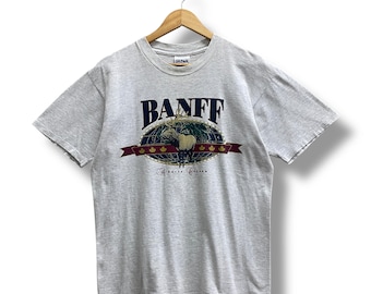 Camiseta gris suave vintage de los años 90, de Banff, Alberta, Canadá, talla XL, con cuello redondo y estampado de ciervo de cola blanca.