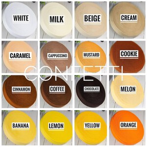 May include: A collection of 16 spools of elastic, each with a different colour and name. The colours include white, milk, beige, cream, caramel, cappuccino, mustard, cookie, cinnamon, coffee, chocolate, melon, banana, lemon, yellow, and orange.