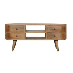 May include: A light wood oval-shaped TV stand with four drawers and two open shelves. The stand has tapered legs.