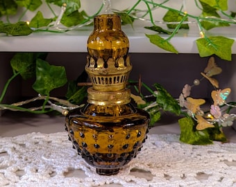 Vintage Mini Amber Glass Oil Lamp marked Made in Hong Kong.