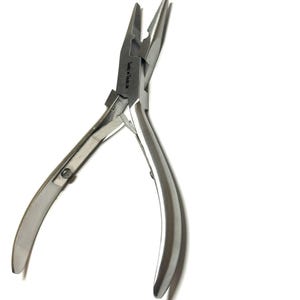 May include: Silver-toned jewelry pliers with a curved handle and a flat jaw. The pliers are labeled "Jew x Tools".