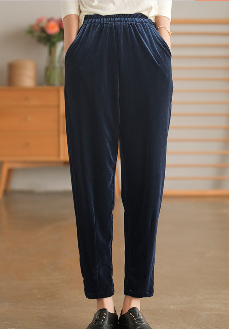 May include: Dark blue velvet pants with an elastic waistband and pockets.