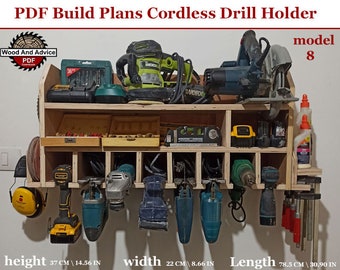 May include: A wooden wall-mounted storage rack for cordless drills and other tools. The rack has shelves for storing tools and a hanging section for drills. The rack is 37 inches tall, 22 inches wide, and 78.5 inches long. The rack is made of plywood and has a natural wood finish. The rack is labeled "model 8".