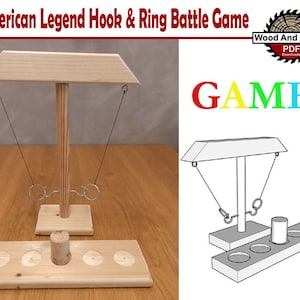May include: A wooden hook and ring game with two rings hanging from a wooden beam. The game has a wooden base with five holes for scoring. The game is labeled "GAME" in colorful letters.