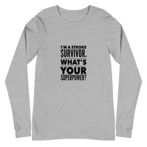 Peut inclure: Un t-shirt à manches longues gris chiné avec du texte noir qui dit "Je suis un survivant d'un AVC. Quelle est votre superpuissance ?"