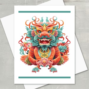 May include: Greeting card featuring a colorful illustration of a Chinese dragon. The dragon is depicted in shades of red, orange, teal, and pink, with intricate details. The card has a white background with teal border lines.