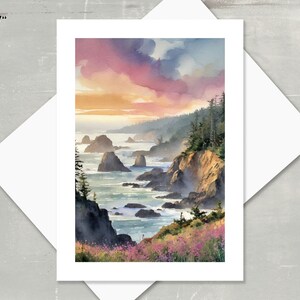 5" X 7" note card watercolor featuring a sunset over a rocky coastline.  The sky is a blend of pink, orange, and purple hues. Dark green trees and cliffs are visible, with dark rocks and ocean waves in the foreground.  Wildflowers are depicted along the cliff edge. The overall color palette is warm and inviting, creating a serene coastal scene.
