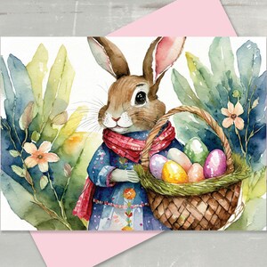 May include: A watercolor painting of a brown rabbit wearing a blue and red dress and a red scarf, holding a basket full of colorful Easter eggs. The rabbit is surrounded by green leaves and pink flowers.