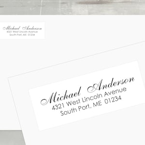 May include: Two white envelopes with address labels. The labels display the name "Michael Anderson" in elegant script, along with the address "4321 West Lincoln Avenue, South Port, ME 01234".