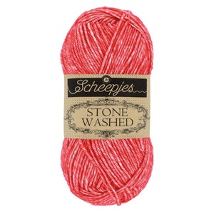 May include: A ball of red and white yarn with a label that reads "Scheepjes Stone Washed"