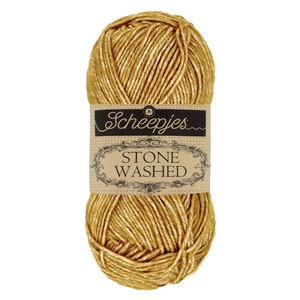 May include: A skein of gold colored yarn labeled "Scheepjes Stone Washed"