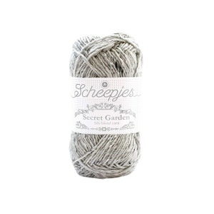 May include: A skein of Scheepjes Secret Garden yarn in a light grey colour. The yarn is a silk blend and is labelled as "Silk blend yarn".