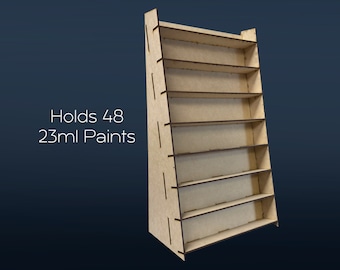 May include: A wooden paint rack with eight shelves, designed to hold 48 bottles of 23ml paint.  The rack is made of light brown wood and has a triangular shape.