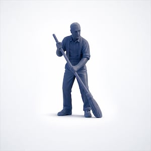 May include: A blue figurine of a man holding a broom. The man is wearing a button-down shirt, suspenders, and trousers. The broom is long and has a brush head. The figurine is set against a white background.