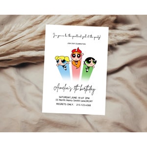 May include: A birthday invitation featuring the Powerpuff Girls cartoon characters. The invitation is for Amelia's 5th birthday party. The text reads "I'm gonna be the prettiest girl at the party!" and "Amelia's 5th birthday". The invitation includes the date, time, and location of the party.