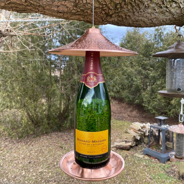 Bird feeder from sparkling wine bottles and PURE copper. Use safflower seeds to attract chickadees and cardinals. NOT for sunflower seeds!