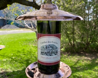 Bird feeder made from recycled wine bottles