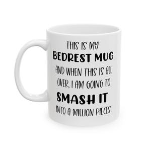 May include: White ceramic mug with a curved handle. The mug features the text "THIS IS MY BEDREST MUG AND WHEN THIS IS ALL OVER, I AM GOING TO SMASH IT INTO A MILLION PIECES" in black lettering. A humorous gift.