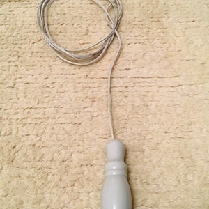 Grey bathroom light pull