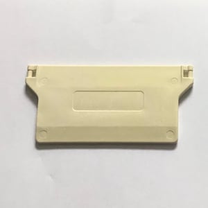 May include: An off-white plastic component, rectangular in shape, with a recessed central section and two hinged tabs at each end. The component has a smooth, matte finish, set against a plain white background.