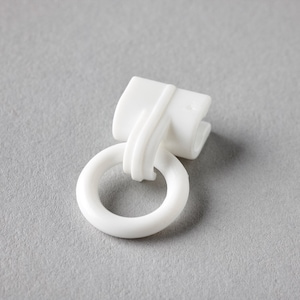 May include: White plastic curtain ring with a loop for hanging curtains.