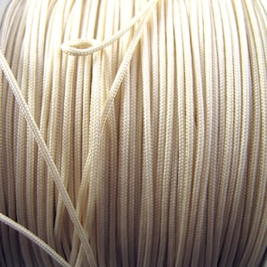 May include: A distressed white wooden sign displaying the word "Welcome" in a handwritten font. The sign has a rustic appearance, suitable for a front door or hallway. The design is simple and elegant.