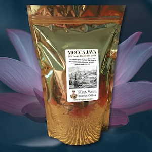 May include: A gold foil bag of Mocca Java coffee beans. The bag features a label with the text "Mocca Java 50% Yemen Matari 50% JAVA" and a vintage illustration of a ship. The label also includes the text "King Hari's Imperial Coffees" and the website address "www.kingharv.com".