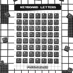 May include: A rectangular sheet labeled KEYBOARD LETTERS at the top and PRISMATASH at the bottom, featuring a grid of black square keyboard keys printed with white letters. Several loose keyboard keys are scattered around the central sheet.