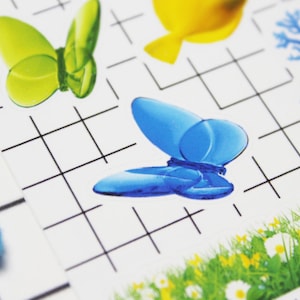 Snap shot of butterfly stickers that come on a Frutiger Aero sticker sheet. Decorate planners or journal pages.