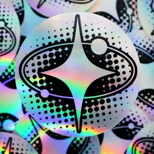 2000's y2k aesthetic bold sparkle sticker with a holographic background