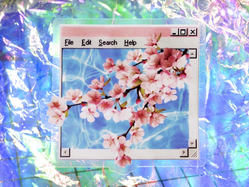 A see threw shot of the vaporwave aesthetic sticker of a pink web window and a pink Japanese cherry blossom extending beyond the frame.