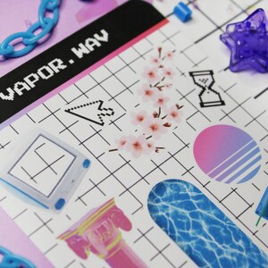 close up of vaporwave sticker sheet with, retro computer, cherry blossom branch, and other vaporwave elements